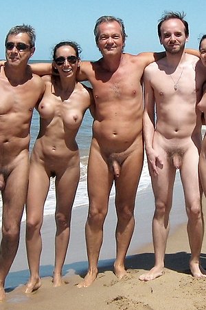 Nudists companies and pair naked on the beach