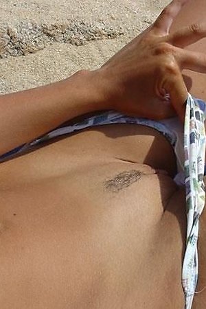 A bikini cutie going topless on the Waikiki