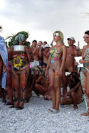 Amateur nudists and theirs beach body painting