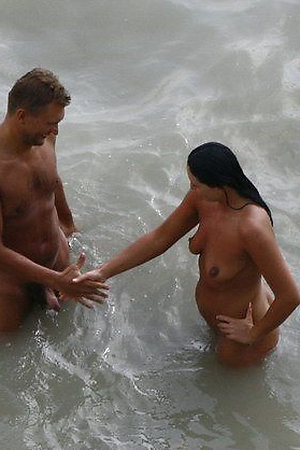 Sexy nudist girls spreads legs on the beach
