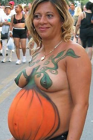 Pregnant nudist with a bodypainting and more