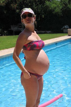 Naturist pregnant amateurs visiting a nudist pool